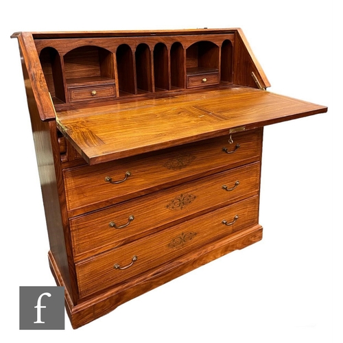 590 - A 20th Century Eastern hardwood bureau, the fitted interior enclosed by a fall inlaid with floral br... 