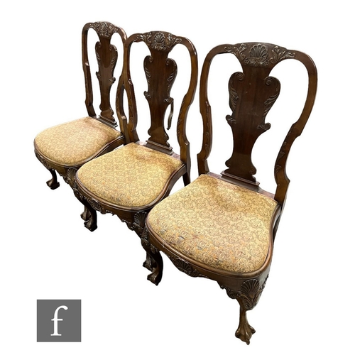 615 - A set of three late 19th or early 20th Century Chippendale style mahogany dining chairs, the shaped ... 