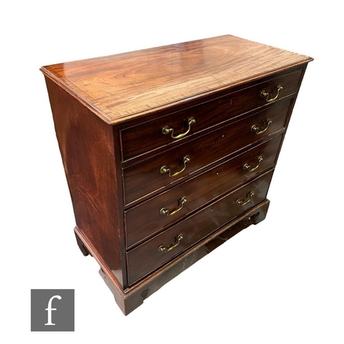 617 - A George III crossbanded and line inlaid straight front chest of four long graduated drawers, brass ... 