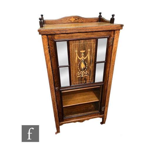 623 - A late Victorian marquetry inlaid rosewood music cabinet enclosed by four mirrored panels and a glaz... 