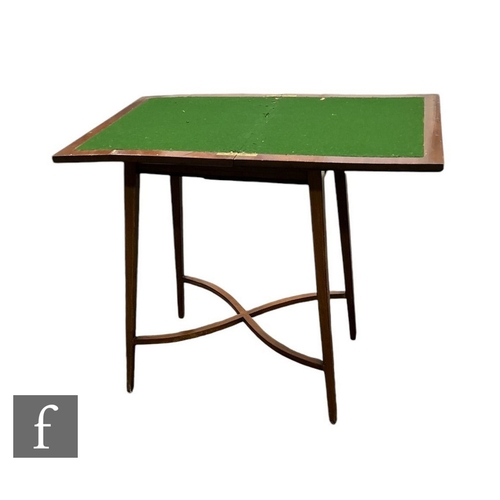 630 - An Edwardian crossbanded mahogany rectangular fold over card table, the green baize top on square ta... 