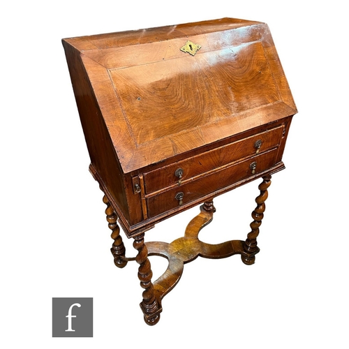 650 - A small Queen Anne style bureau of small proportions, the fitted interior enclosed by a feather band... 