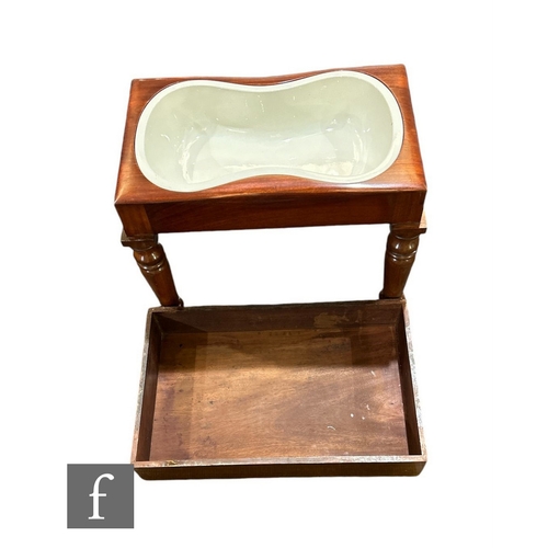 633 - A Victorian mahogany bidet with white glazed pottery liner on turned legs and peg feet, width 53cm.