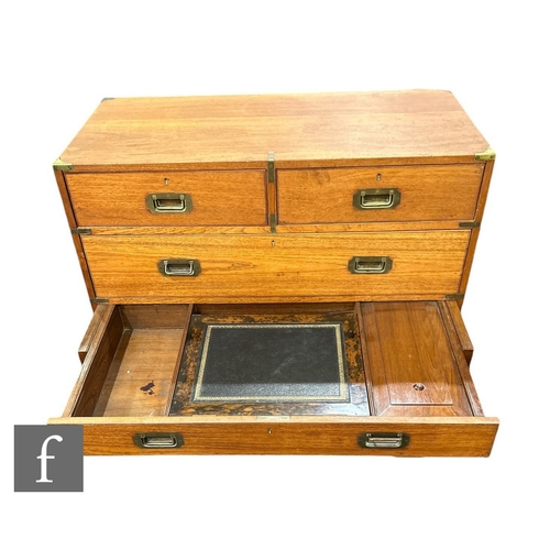 645 - A 19th Century teak military chest of two short and three long drawers, the centre drawer fitted wit... 