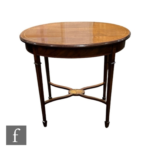 634 - An Edwardian oval mahogany occasional table on square tapering collared legs terminating in spade fe... 