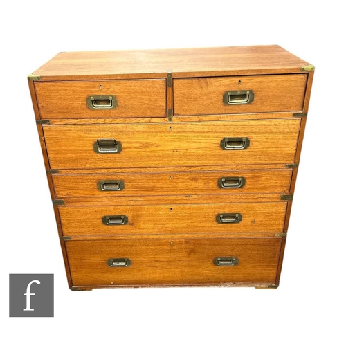 645 - A 19th Century teak military chest of two short and three long drawers, the centre drawer fitted wit... 