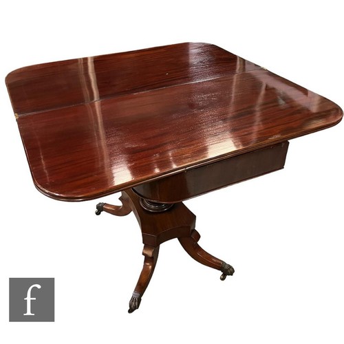 616 - A 19th Century rectangular mahogany fold over tea table, the double reeded edge top on a turned pede... 