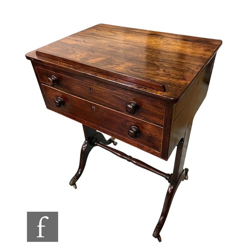 642 - A 19th Century rosewood reading table with a dummy drawer over single drawer with divisioned interio... 