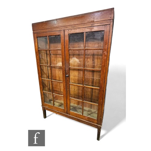 649 - A large 19th Century oak bookcase enclosed by a pair of double bar glazed doors on separate stand, h... 