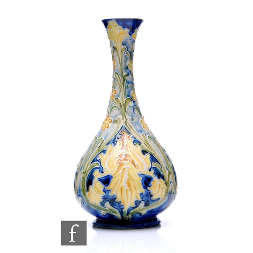 75 - William Moorcroft - James Macintyre & Co - A Florian range vase circa 1905, with stylised Iris, ... 