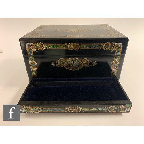 65 - A silver plated and clear cut glass travelling vanity box, the ebonised case with inlaid abalone she... 