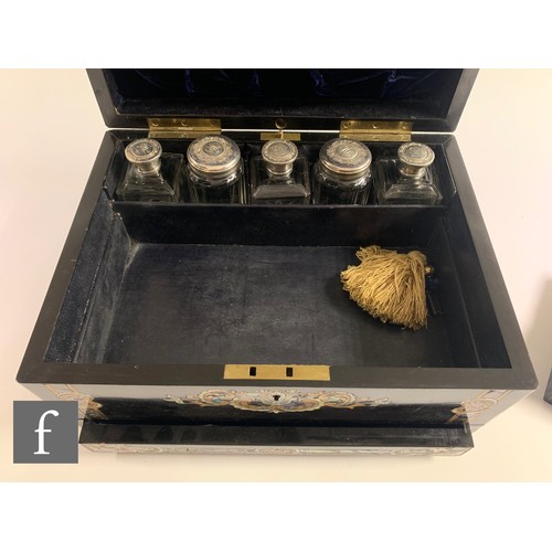 65 - A silver plated and clear cut glass travelling vanity box, the ebonised case with inlaid abalone she... 