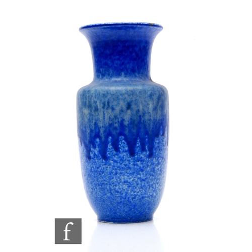 102 - Ruskin Pottery - A blue crystalline vase of shouldered form with drawn neck and flared rim, tonal bl... 