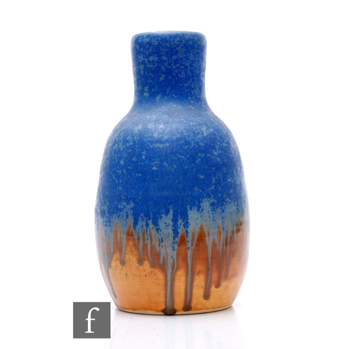 103 - Ruskin Pottery - A crystalline vase of ovoid form with high drawn collar, blue to orange dribble gla... 