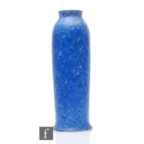 105 - Ruskin Pottery - A blue crystalline vase of slender sleeve form and flared rim, mottled tonal blue g... 