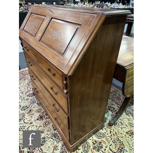 590 - A 20th Century Eastern hardwood bureau, the fitted interior enclosed by a fall inlaid with floral br... 