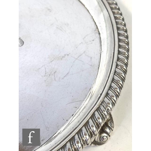 50 - A hallmarked silver circular slaver with engraved central crest within a rope twist borders, weight ... 