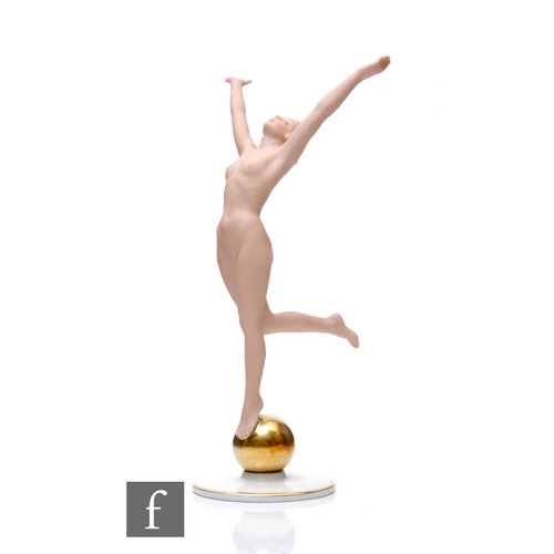 574 - Karl Tutter - Hutschenreuther - An Art Deco figurine, Sun Child, modelled as a female nude with arms... 