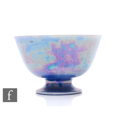 125 - Ruskin Pottery - A lustre egg shell bowl of circular pedestal footed form, mottled lavender/blue iri... 