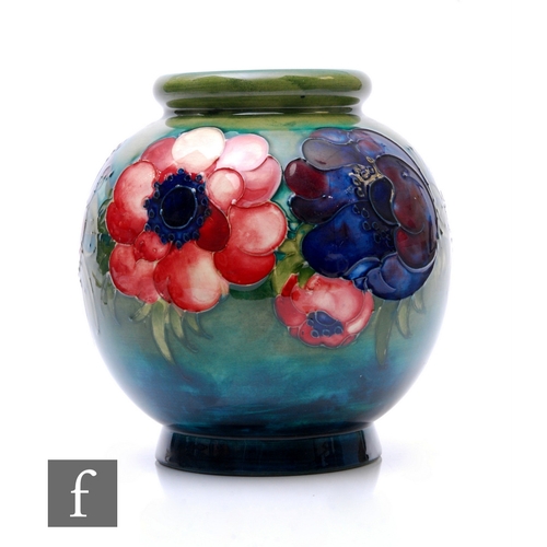 69 - William Moorcroft - A Moorcroft Pottery anemone vase, footed globular form, circa 1950, tubeline dec... 