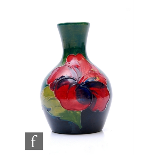 79 - Walter Moorcroft - Moorcroft - A vase of baluster form, circa 1950, tubeline decorated with flower h... 