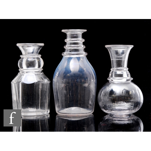 362 - Three 19th Century glass carafes, comprising an ovoid example, circa 1820, with a three ringed neck,... 