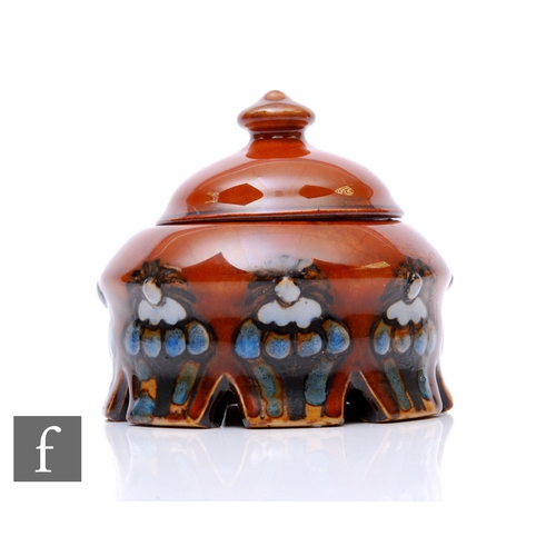 7 - A Royal Doulton stoneware jar and cover, domed lid with knopped finial, the compressed spherical bod... 