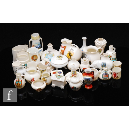 196 - A collection of crested china wares, to include a Goss crested china jug 'Bournemouth Gardens', heig... 