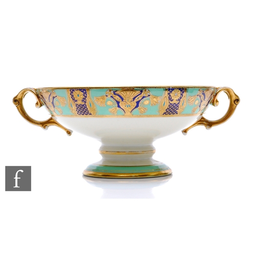 203 - A 1920s Noritake porcelain pedestal bowl of footed circular form with loop handles, relief paste gil... 