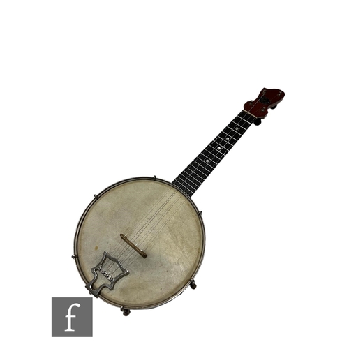 551 - A 1930s or earlier four string banjo by John Grey & Sons London, length 56cm, in black canvas ca... 