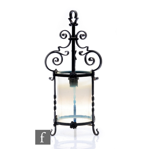 62 - Unattributed maker - An early 20th Century Arts and Crafts wrought iron hall lantern, of cylindrical... 