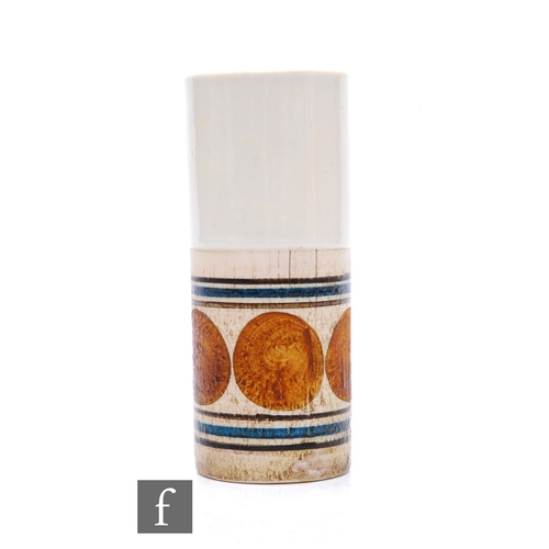 749 - Honor Curtis - Troika Pottery - A cylinder vase, the lower half decorated with a band of ochre circl... 