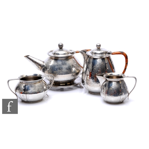 61 - Walker & Co - Homeland - An Arts & Crafts style English Pewter four-piece tea service, the t... 