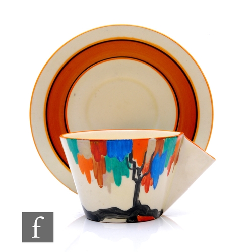 175 - Clarice Cliff - Latona Tree - A Conical shape tea cup and saucer circa 1930, hand painted with a sty... 