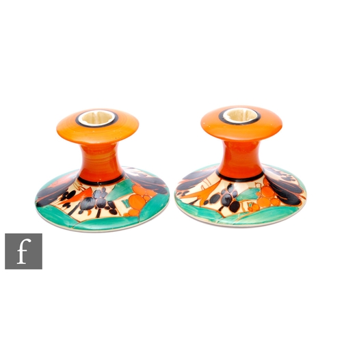 182 - Clarice Cliff - Orange Trees & House - A pair of shape 310 candlesticks circa 1930, each hand pa... 