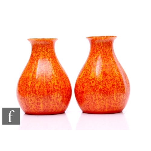 143 - Pilkingtons Royal Lancastrian Pottery - A near pair of shape 2782 vases of baluster fluted form, dec... 