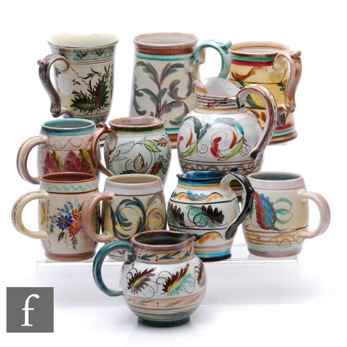 784 - Glyn Colledge - Bourne Denby - A collection of seven earthenware tankards, each decorated with styli... 