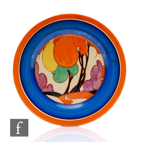 193 - Clarice Cliff - Autumn (Variant) - A circular plate circa 1930, hand painted with a stylised tree an... 