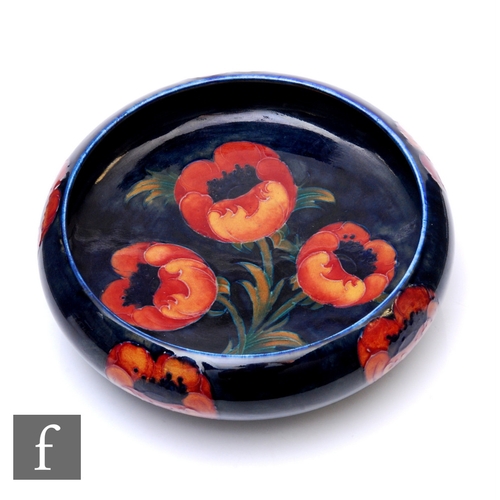 86 - William Moorcroft - Big Poppy - A footed bowl of circular form with inverted rim, circa 1930, the in... 