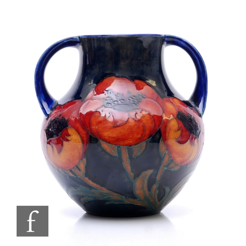 88 - William Moorcroft - Big Poppy - A twin handled vase, circa 1925, of compressed baluster form, tubeli... 