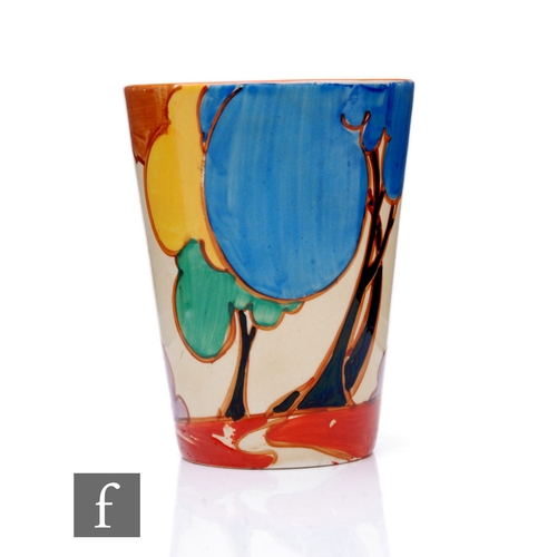 253 - Clarice Cliff - Blue Autumn - A beaker circa 1930, hand painted with a stylised tree and cottage lan... 