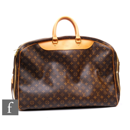 1319 - Louis Vuitton - A monogram leather Alize weekend travel bag, with Vachetta leather detailing and gol... 