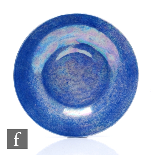 131 - Ruskin Pottery - A lustre plate of circular form, with blue/lilac mottled glaze, impressed marks to ... 