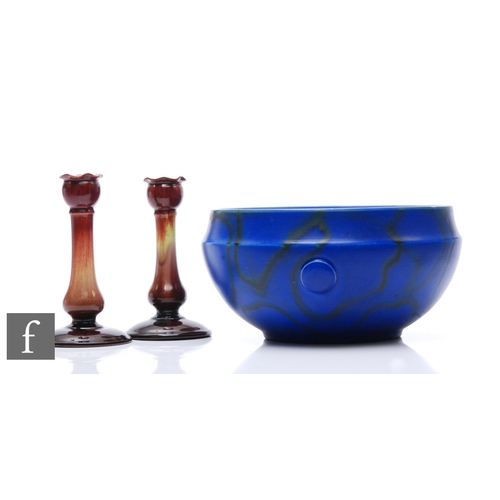 596 - Bretby - A blue glazed jardiniere with applied cabochons and black trailed decoration, impressed mar... 