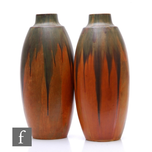 597 - Denbac - A pair of French earthenware vases of elongated ovoid form with angular shoulder and swept ... 