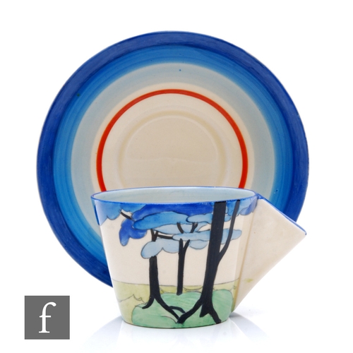 266 - Clarice Cliff - Blue Firs - A Conical shape coffee cup and saucer circa 1932, hand painted with a st... 