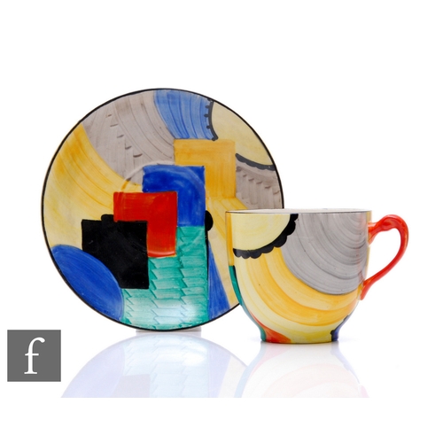 607 - Susie Cooper - Grays Pottery - A Cubist pattern tea cup and saucer decorated with brightly coloured ... 