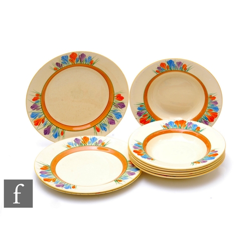 571 - Clarice Cliff - Crocus - A part dinner service circa 1936, comprising three dinner plates and six la... 