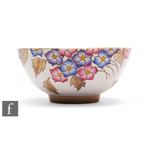 637 - Charlotte Rhead - Bursley Ware - A 1930s Art Deco bowl of circular form, tubeline decorated with flo... 