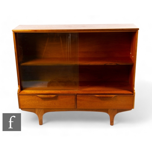 909 - Sutcliffe of Todmorden - A 1960s teak glass fronted cabinet, the two lower drawers below sliding gla... 